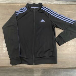 Woman’s Adidas zip up jacket in black and lilac size Medium.